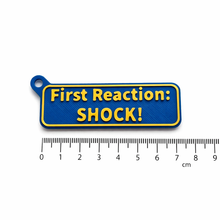 Load image into Gallery viewer, Portachiavi - First Reaction: SHOCK!
